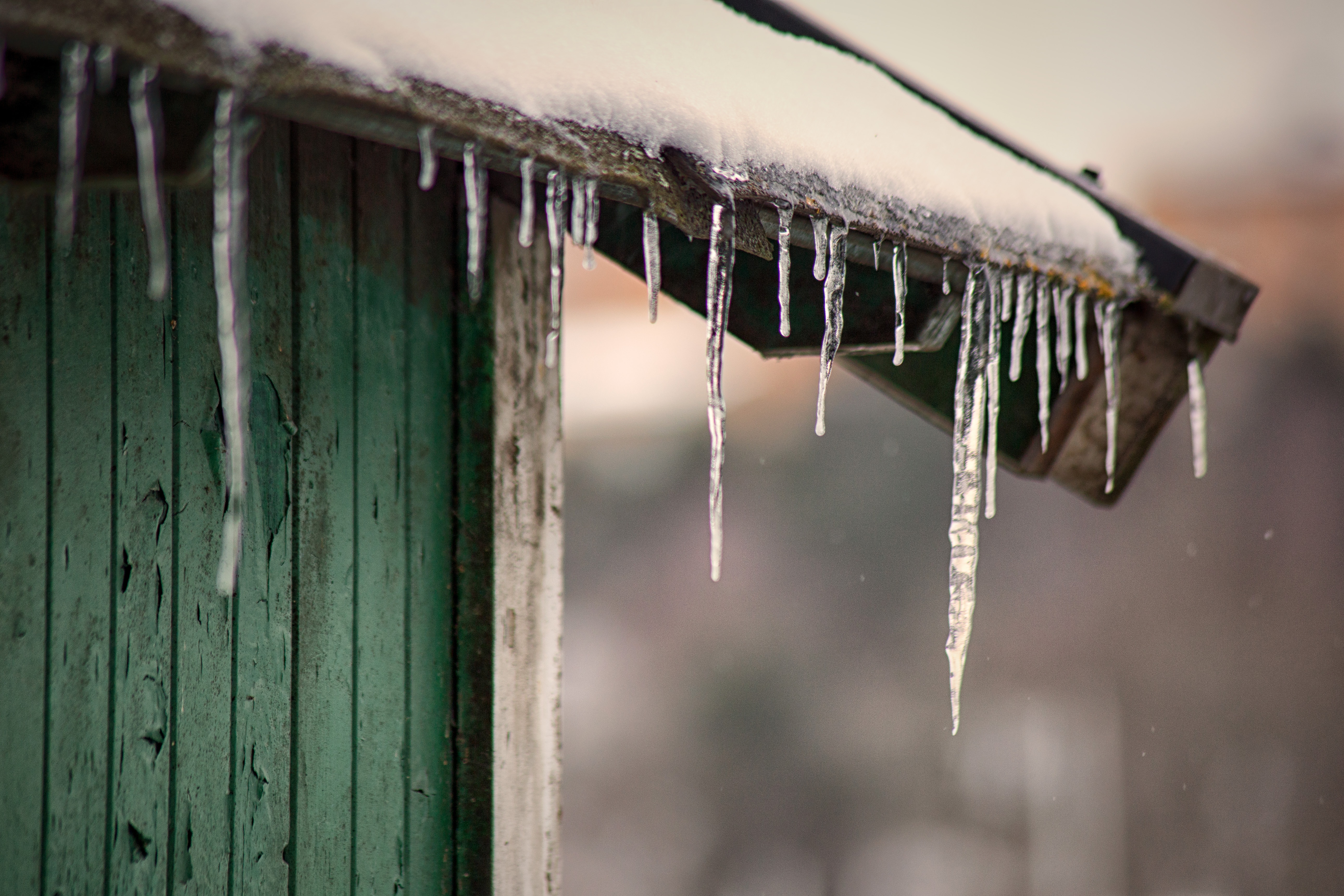 shed with icicles and water damage