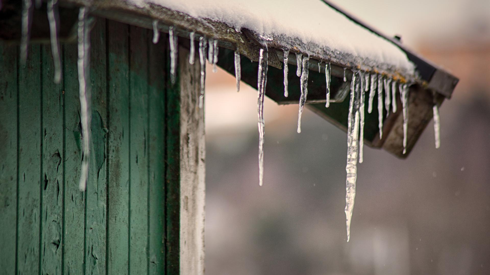 shed with icicles and water damage